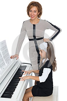 Teacher and student at piano