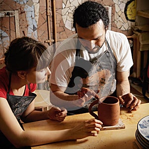 Teacher and student potters photo