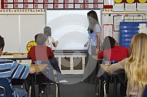 Teacher And Students In Classroom