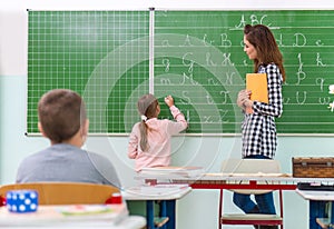 Teacher and students in the classroom: teaching