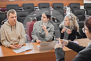 The teacher and students communicate in sign language in the classroom. Hearing impaired and deaf people