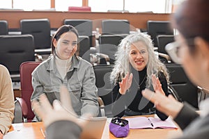 The teacher and students communicate in sign language in the classroom. Hearing impaired and deaf people