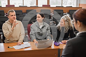 The teacher and students communicate in sign language in the classroom. Hearing impaired and deaf people