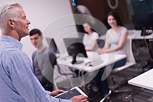 Teacher and students in computer lab classroom