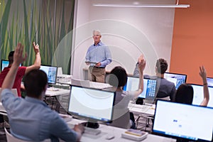 Teacher and students in computer lab classroom