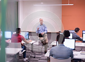 Teacher and students in computer lab classroom