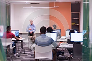 Teacher and students in computer lab classroom