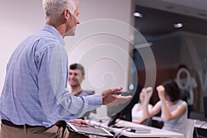 Teacher and students in computer lab classroom