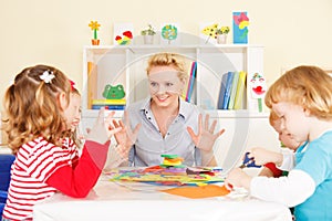 Teacher talking with children.