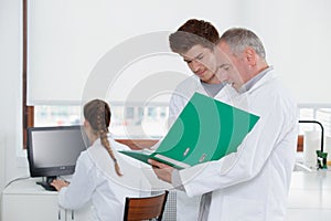 Teacher talking to lab student