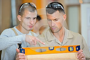 teacher talking to student using level in school