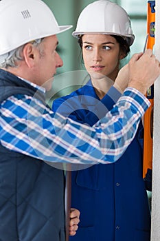 Teacher talking to student using level