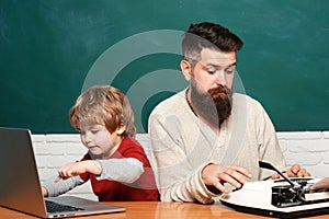 Teacher teaches a student to use a microscope. Education and learning people concept - little student boy and Teacher