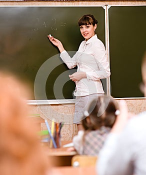 Teacher teaches students in classroom