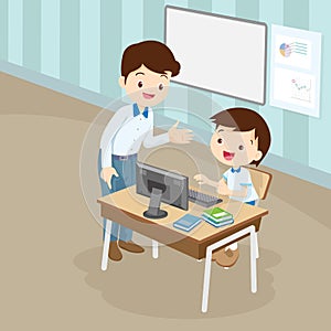 Teacher teaching computer to student boy