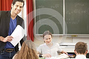 Teacher teaching or educate at the board a class in school