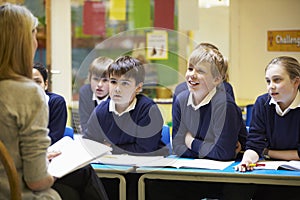 Teacher Teaching Lesson To Elementary School Pupils