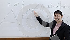 Teacher is teaching physics to students during the new school days after a long break, High school student classroom