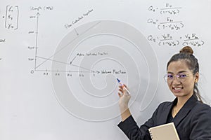 Teacher is teaching physics to students during the new school days after a long break, High school student classroom