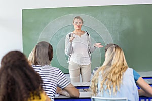 Teacher teaching students in class