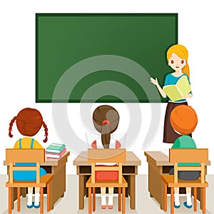 Teacher Teaching Students In Classroom