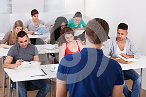 Teacher teaching university students