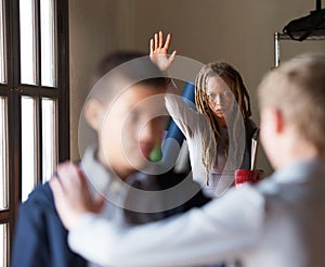 Teacher trying to stop a fight in school