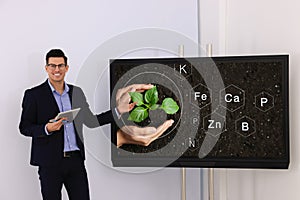 Teacher using interactive board in classroom during lesson