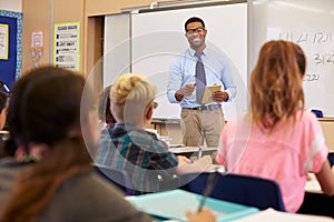 Teacher using tablet computer in an elementary school class