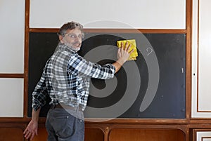 Cleaning a blackboard photo