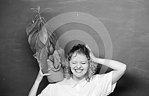 Teacher woman in glasses at biology lesson. tree of knowledge. school learning ecology. happy student girl with plant at