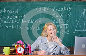 Teacher woman sit table chalkboard background. Organize class and make learning easy and meaningful process. Well