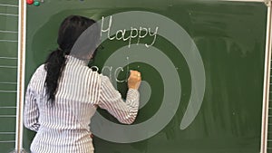 Teacher writes Happy Teacher`s Day