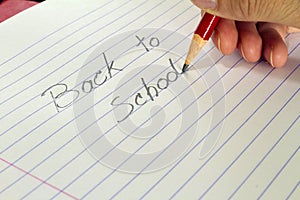 Teacher writing back to schoo