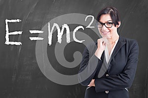 Teacher written on the blackboard formula in physics