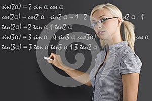 Teacher young woman at blackboard