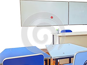 Teachers desk and white board in classroom