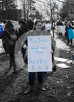 Teachers Need More Than Apples - Woman Holding School Strike Picket Sign