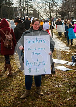 Teachers Need More Than Apples - Woman Holding School Strike Picket Sign