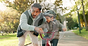 Teaching, bicycle and father with his son, support and talking with happiness, learning and safety. Male parent, kid and