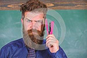 Teaching memorization techniques. Back to school and studying. Teacher bearded man with pink stapler chalkboard photo