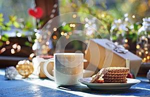 Teacup and Christmas gluten free cookies on a table