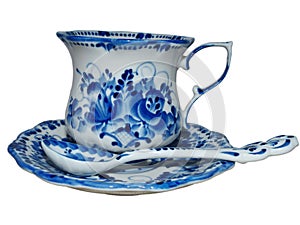 Teacup with saucer and teaspoon in Russian traditional Gzhel style. Gzhel-Russian folk craft of ceramics and production porcelain