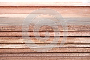 Teak wood piles sawed background