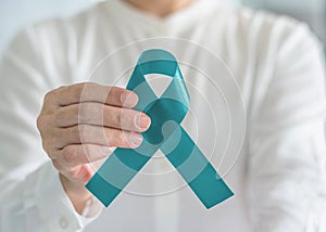 Teal awareness ribbon bow color for Ovarian Cancer, Polycystic Ovary Syndrome PCOS and Post Traumatic Stress Disorder PTSD photo