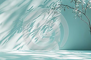 Teal background with tree branches with shadows on a wall