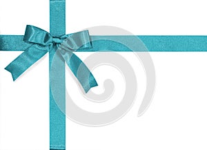 Teal bow satin ribbon isolated on white background with clipping path for gift box wrap and holiday card design decoration element