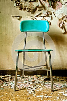 Teal Chair in Abandoned Building