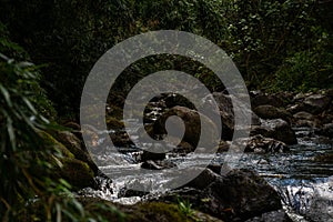 Teal colored stream deep in mountains