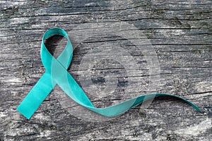 Teal ribbon awareness isolated with clipping path for Ovarian Cancer, Polycystic Ovarian Syndrome PCOS disease, Post Traumatic photo